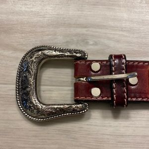 Ariat Brown leather belt with southwestern leather design.